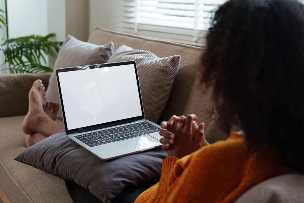 Woman using a laptop at home for an online counseling session