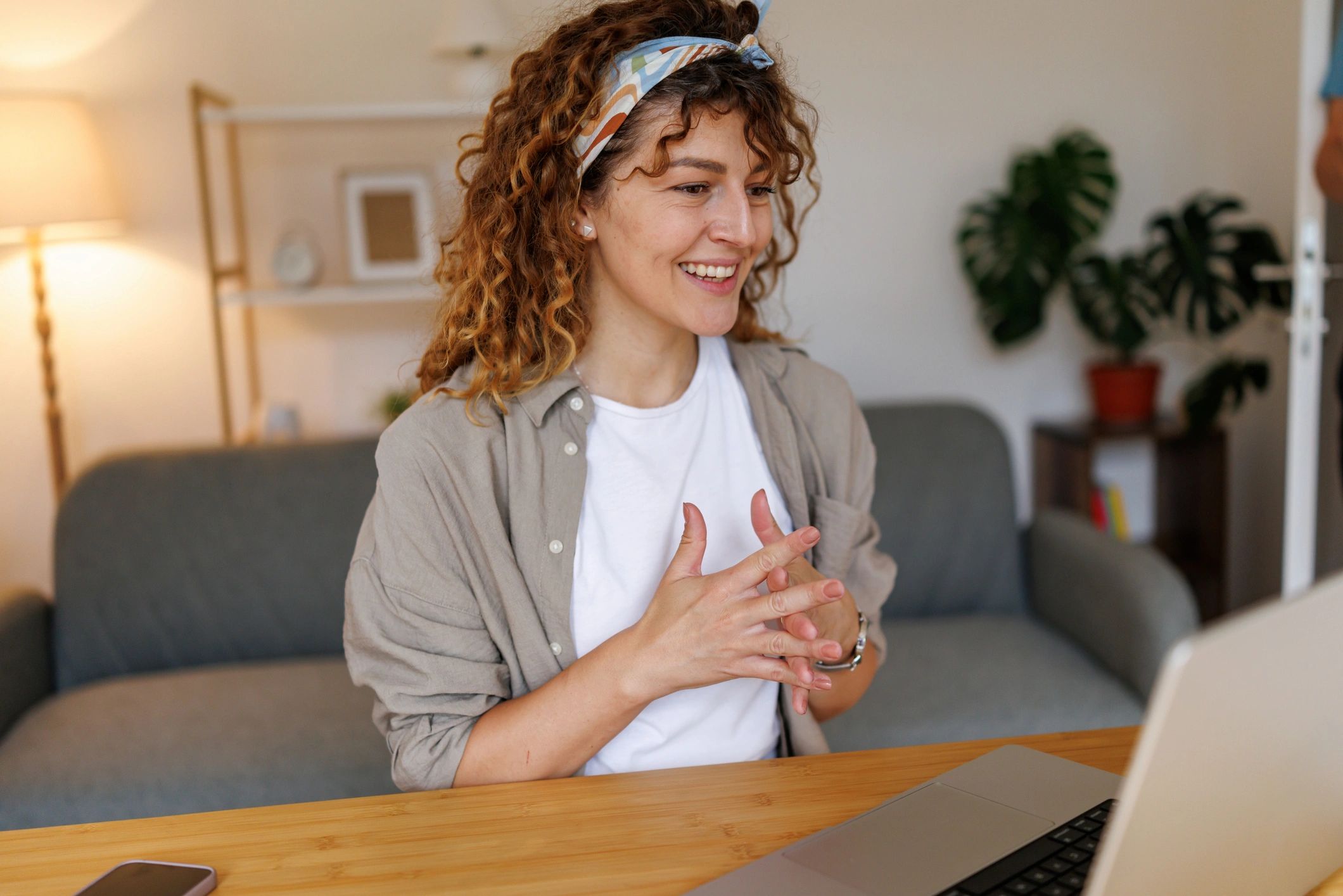 Woman in an online therapy session on a laptop