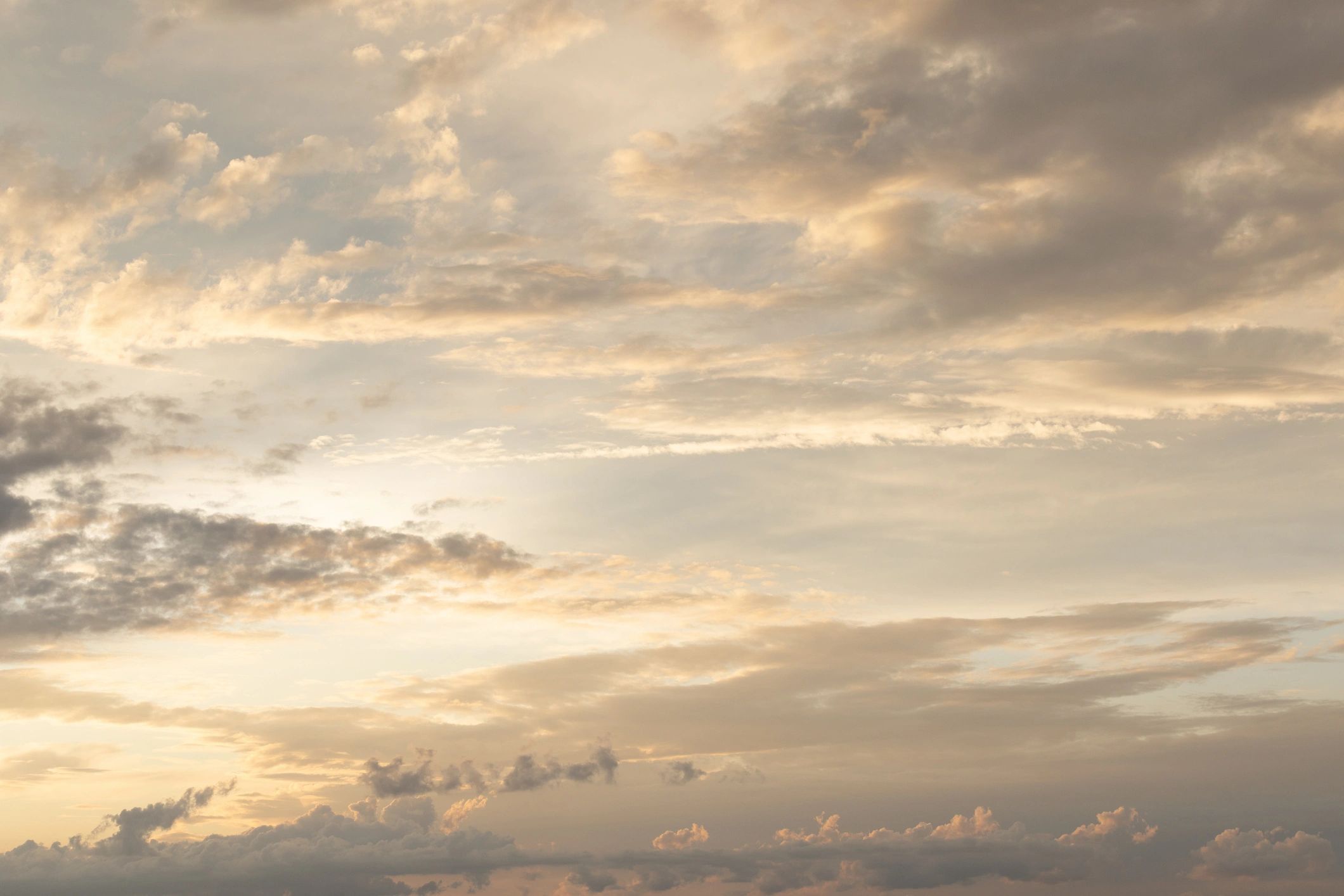 Soft Sunset Sky With Clouds Over Calm Horizon At Dusk